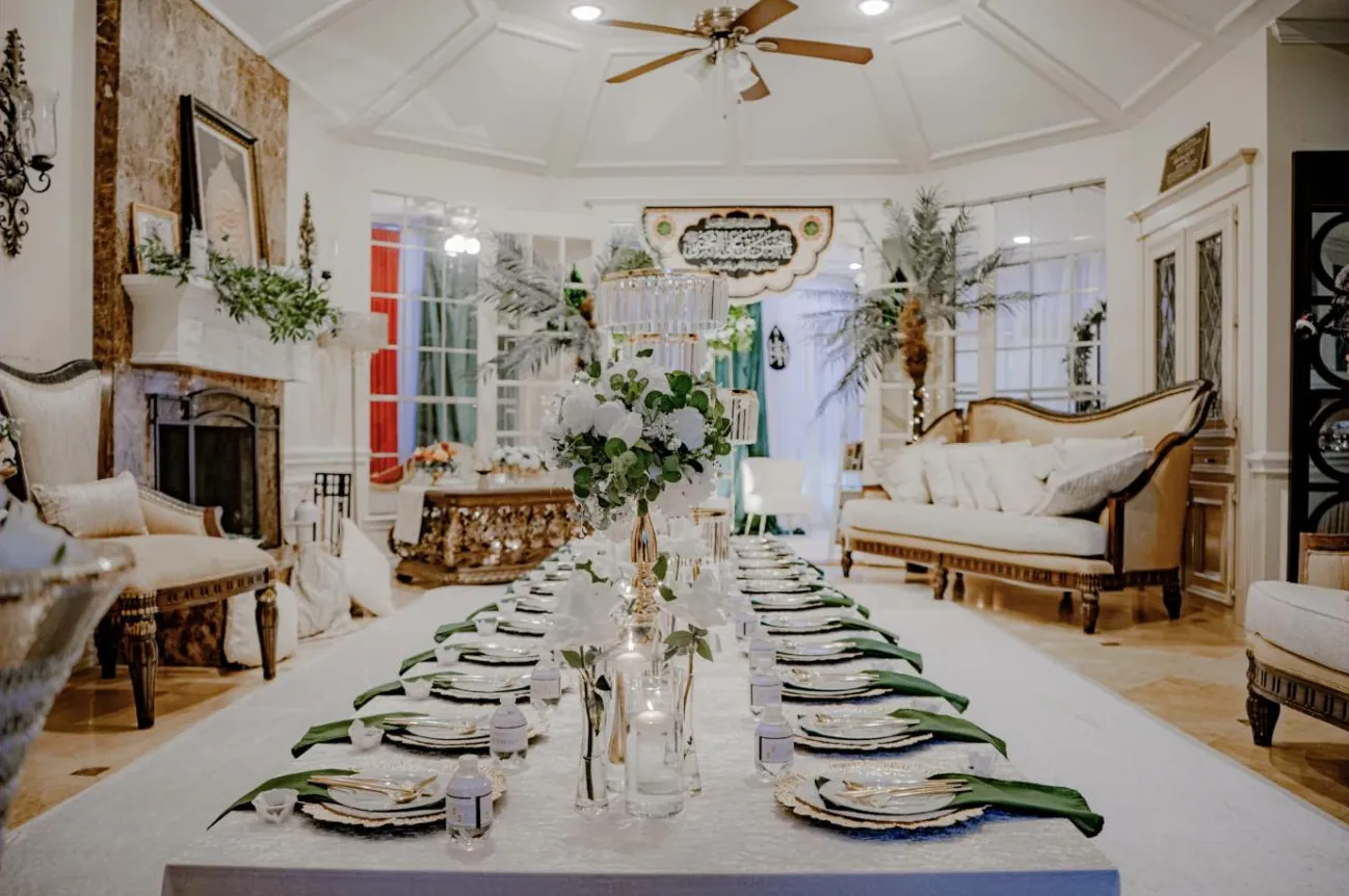 Estate tablescape with greenery runner and gold chargers